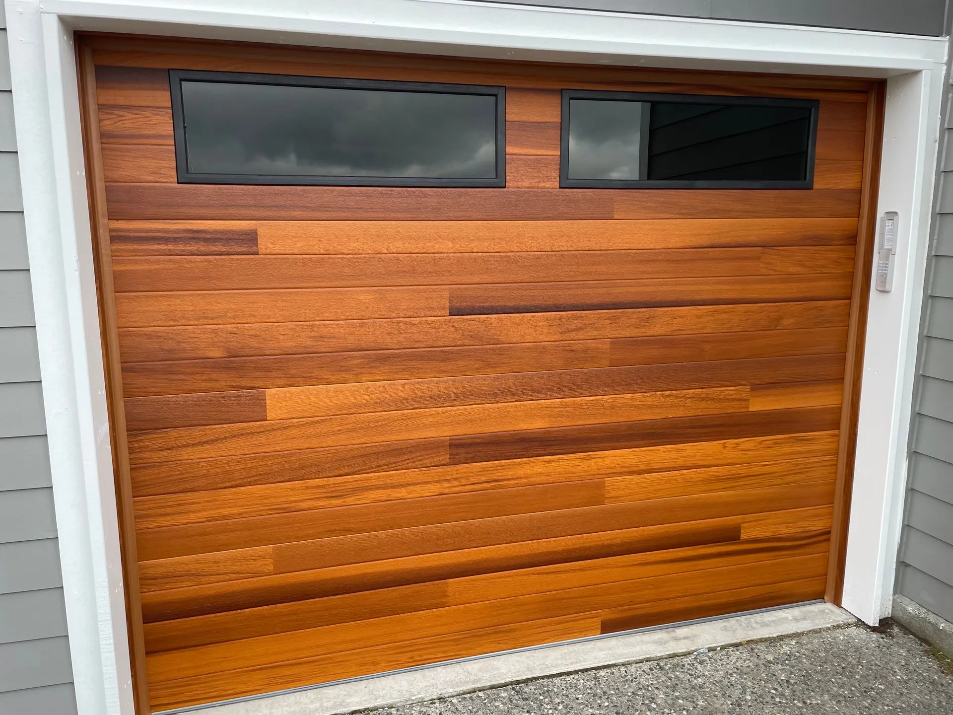 9x7 CHI Planks model 2347 door in cedar with tinted glass and black frames