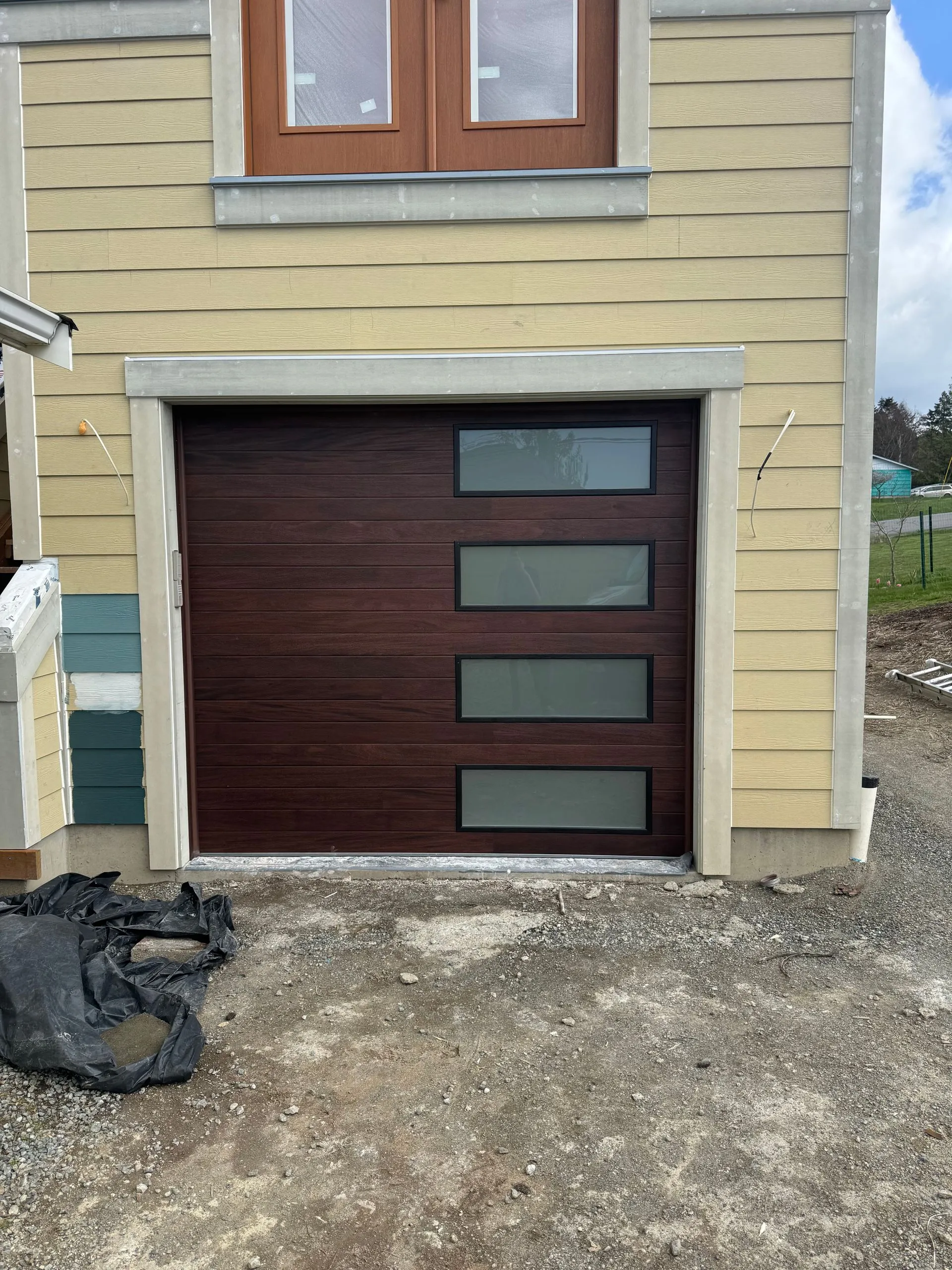 9x8 CHI Planks model 2357 door in mahogany with oversized frosted insulated glass