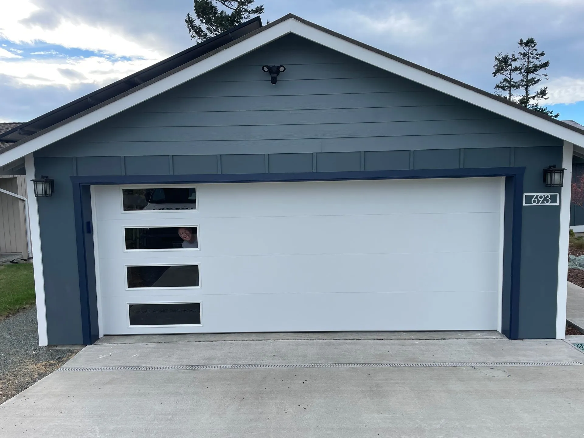 18x7 Northwest Door Modern Tech garage door with Harmony glass on the left