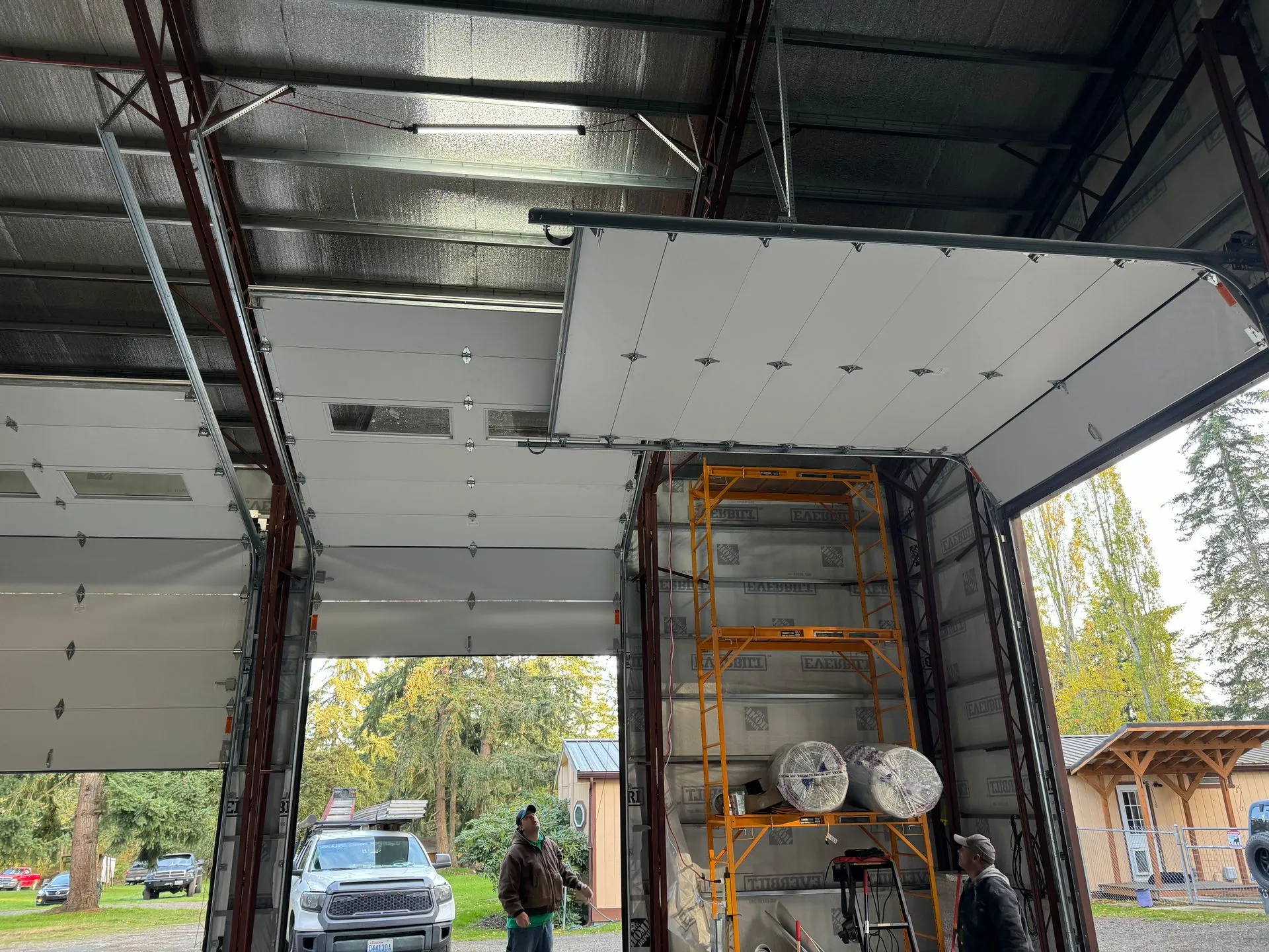 Pitch-rise high-lift track on 10x14 Vantage Long doors, seen from inside the building